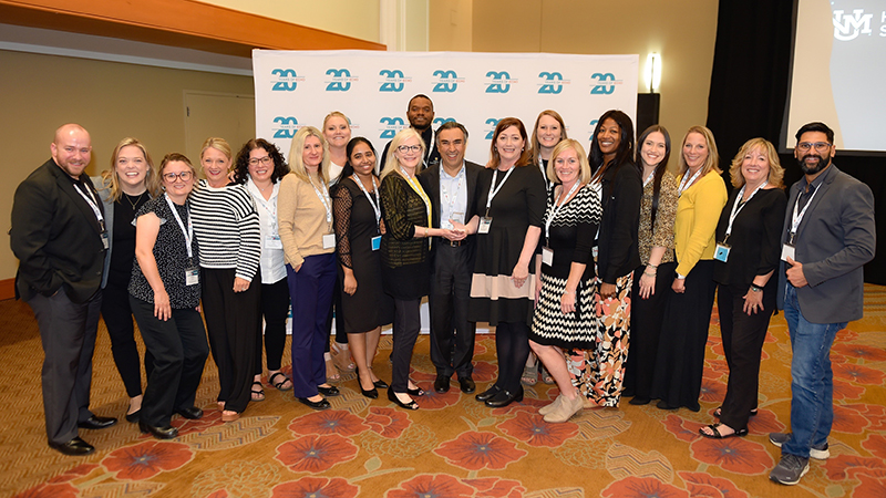 The Show-Me ECHO team poses for a photo with Dr. Sanjeev Arora, founder of Project ECHO, after receiving an international award for ECHO Excellence.