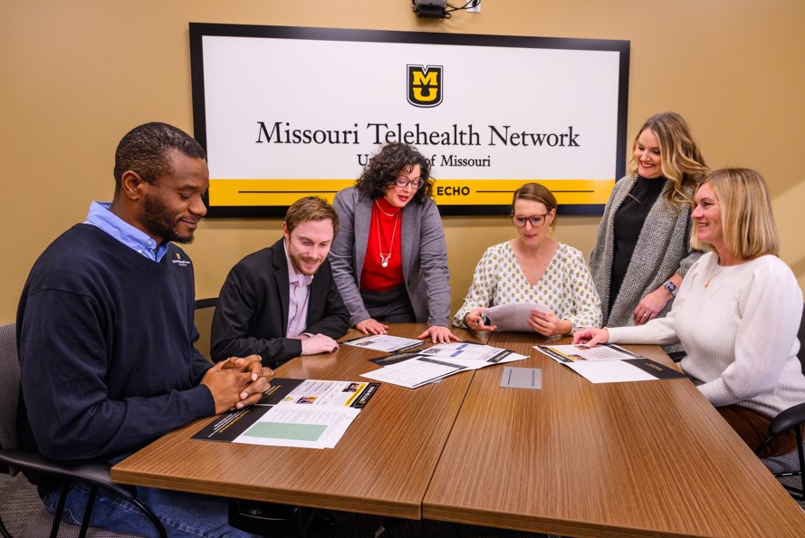 Missouri Telehealth Network professionals collaborate around a table.