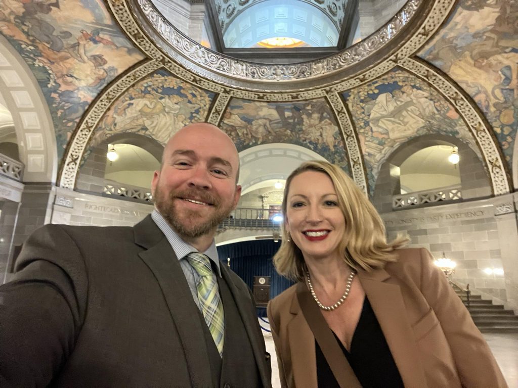Two representatives of Mizzou posing in the rotunda of the Missouri Capitol Building.